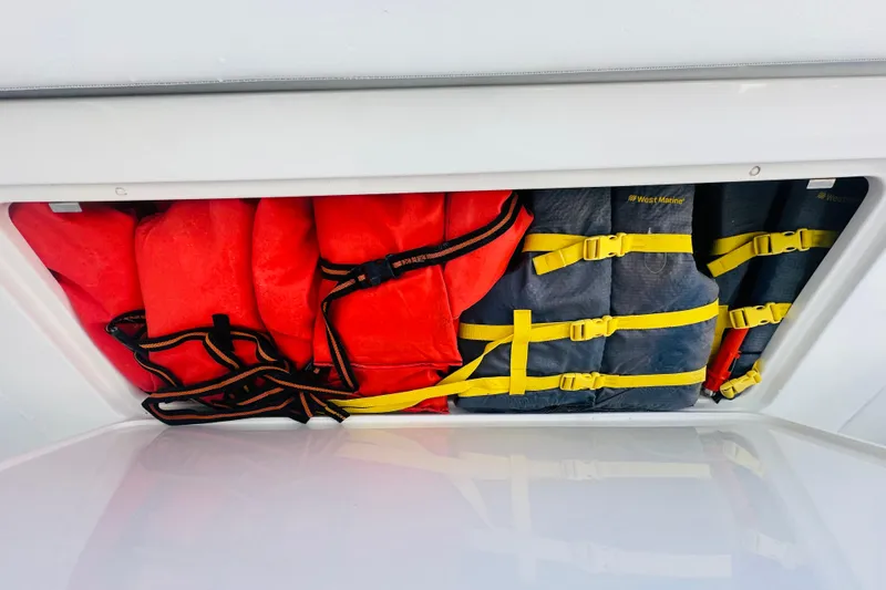  Yacht Photos Pics Life jackets stored in a 2015 Jupiter 38 FS boat compartment.
