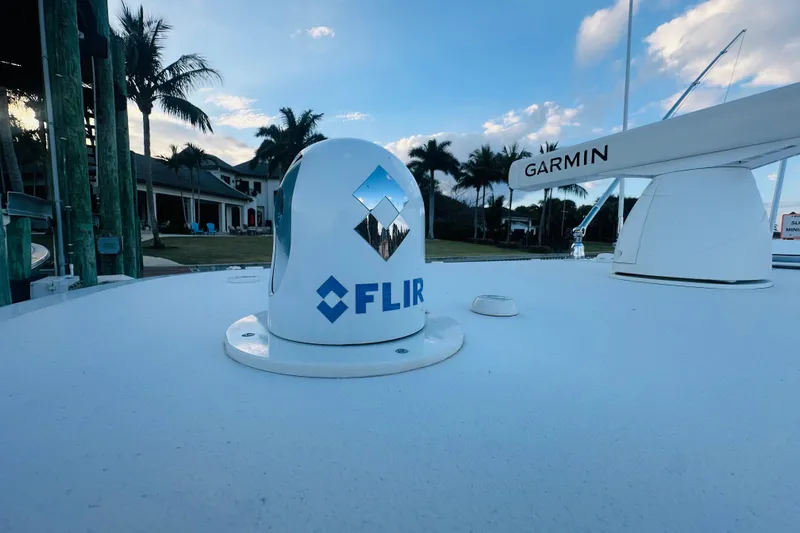  Yacht Photos Pics FLIR and Garmin equipment on 2015 Jupiter 38 FS boat under blue sky.