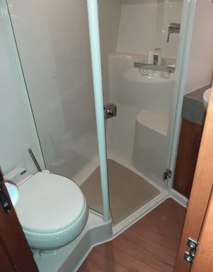 2009 Riviera 47 Yacht Photos Pics 2009 Riviera 47 Enclosed Flybridge Series II bathroom with shower and toilet.