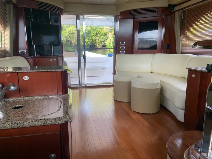 Yacht Photos Pics Luxurious interior of 2006 Sea Ray 52 Sedan Bridge yacht with modern furnishings.