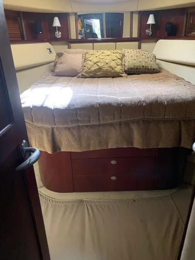  Yacht Photos Pics Interior cabin of 2006 Sea Ray 52 Sedan Bridge with cozy bed and pillows.