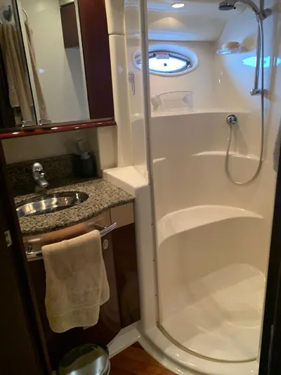  Yacht Photos Pics Luxurious bathroom in 2006 Sea Ray 52 Sedan Bridge yacht with shower and sink.