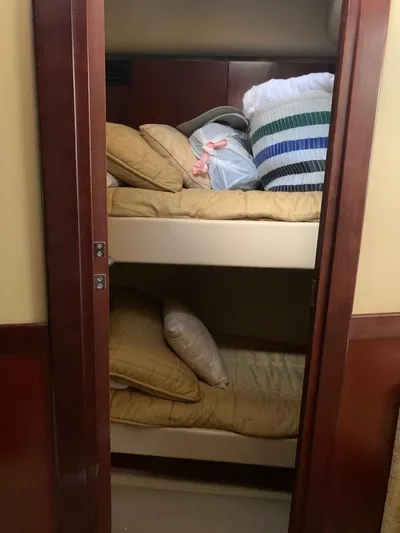  Yacht Photos Pics Bunk beds in 2006 Sea Ray 52 Sedan Bridge yacht cabin with pillows and bedding.