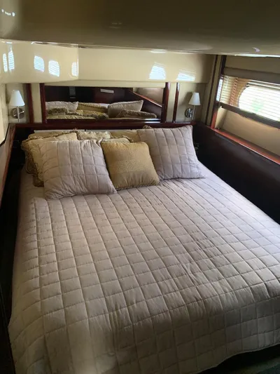  Yacht Photos Pics Luxurious bedroom interior of 2006 Sea Ray 52 Sedan Bridge yacht.