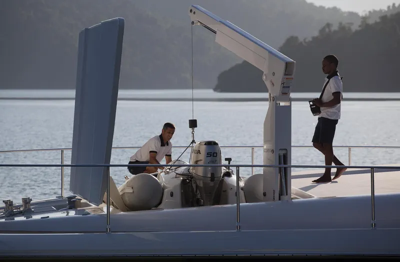 Mare Blu Yacht Photos Pics Two crew members on 2008 Pro Boat Yachts Power Cat 80, managing equipment on deck.