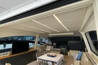 Luxurious interior of a 2015 Pershing 70 yacht with elegant seating and modern decor.