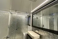 Luxurious bathroom in 2015 Pershing 70 yacht with modern fixtures and elegant design.