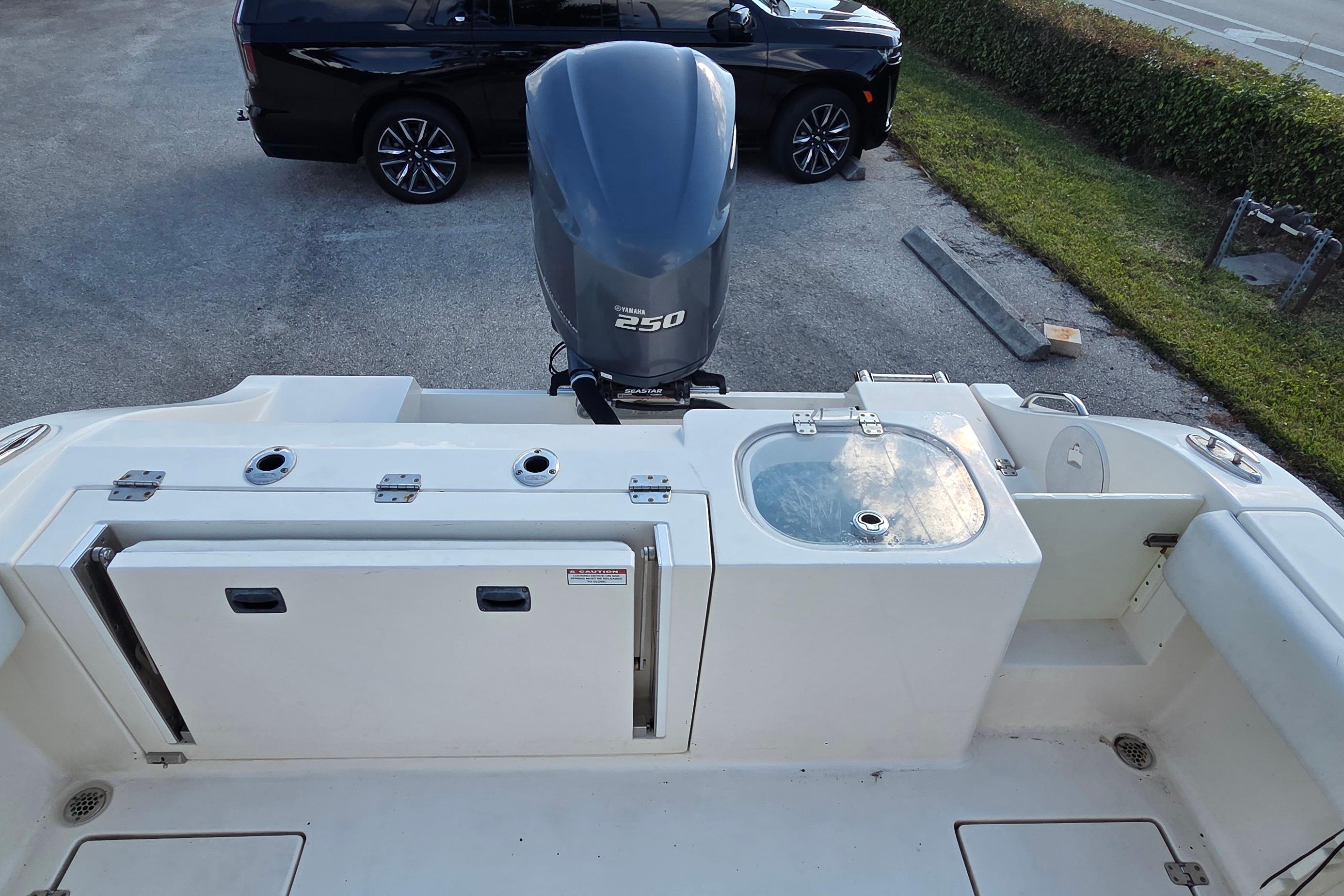 2020 Cobia 237 Center Console boat with Yamaha 250 engine, featuring a clean deck layout.