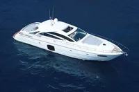 2015 Pershing 70 yacht cruising on open blue sea.