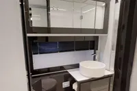 Luxury bathroom in a 2015 Pershing 70 yacht with modern fixtures and sleek design.
