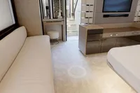Luxurious interior of a 2015 Pershing 70 yacht with modern furnishings and sleek design.
