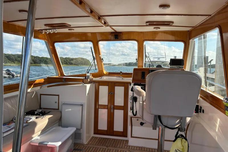 Pearl Yacht Photos Pics Interior of a 1999 Eastbay 38 boat with wooden accents and scenic water view.