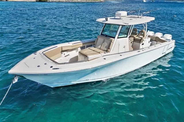 Odd Job Yacht Photos Pics 2019 Sailfish 360 CC boat on clear blue water, showcasing sleek design and spacious deck.