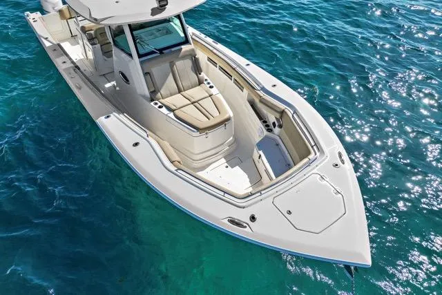 Odd Job Yacht Photos Pics 2019 Sailfish 360 CC boat on clear blue water, showcasing sleek design and spacious seating.