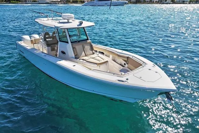 Odd Job Yacht Photos Pics 2019 Sailfish 360 CC boat on clear blue water, showcasing sleek design and spacious deck.