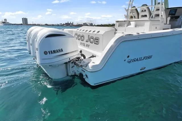 Odd Job Yacht Photos Pics 2019 Sailfish 360 CC boat with Yamaha engines on clear blue water.