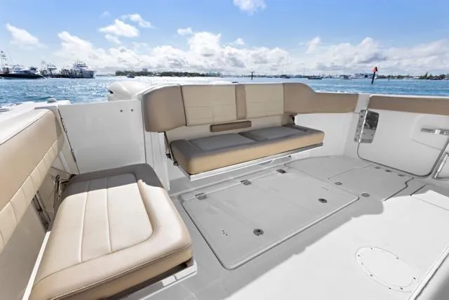 Odd Job Yacht Photos Pics 2019 Sailfish 360 CC boat interior with beige seating, ocean view.