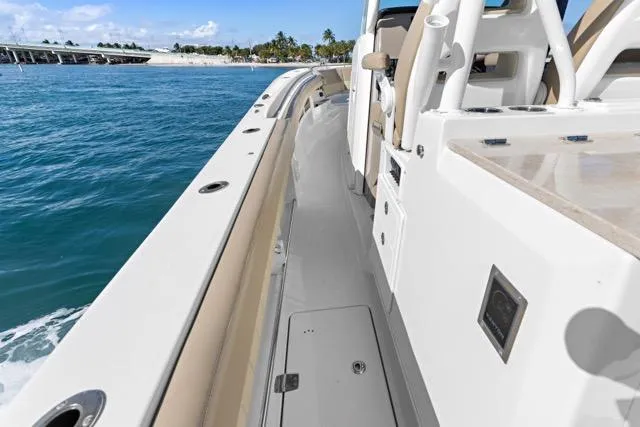 Odd Job Yacht Photos Pics 2019 Sailfish 360 CC boat deck with ocean view and seating area.