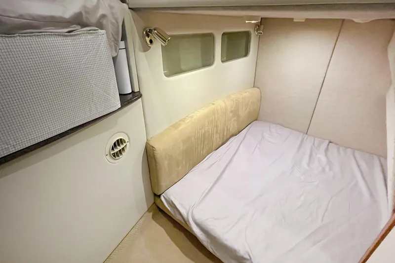 Lucky Stars Yacht Photos Pics 2002 Bayliner 3788 Convertible Sedan cabin interior with bed and storage.