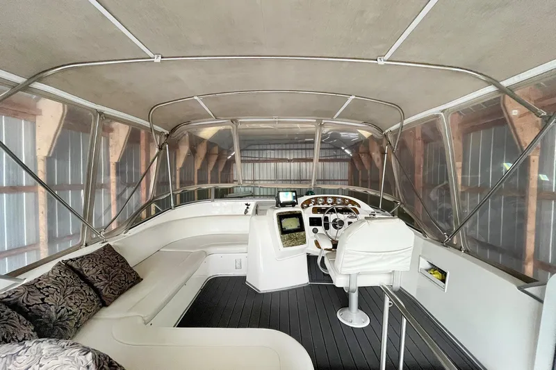 Lucky Stars Yacht Photos Pics 2002 Bayliner 3788 Convertible Sedan interior with helm, seating, and navigation equipment.