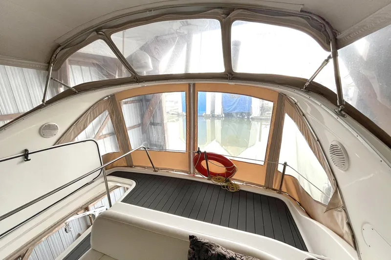 Lucky Stars Yacht Photos Pics 2002 Bayliner 3788 Convertible Sedan interior with enclosed deck and seating area.