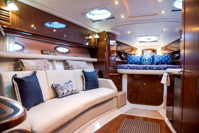  Yacht Photos Pics Luxurious interior of 2014 Four Winns V375 yacht with elegant seating and bedding.