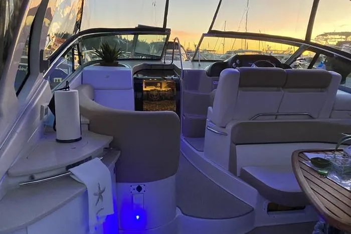  Yacht Photos Pics 2014 Four Winns V375 boat interior with elegant seating and sunset view.