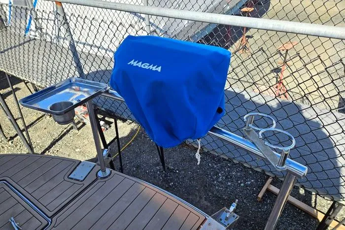  Yacht Photos Pics 2014 Four Winns V375 boat with Magma grill and cup holders on deck.