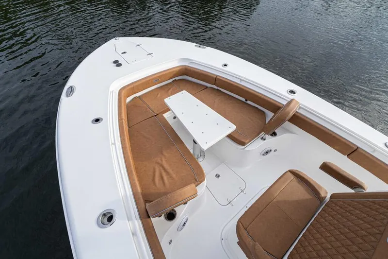  Yacht Photos Pics Manufacturer Provided Image: 2026 Sea Hunt Ultra 285 SE boat with tan seating and white table on water.