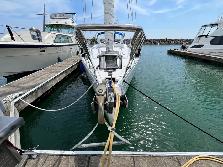 Lali Yacht Photos Pics 1994 Beneteau Oceanis 510 CU sailboat docked in a marina, surrounded by calm water.