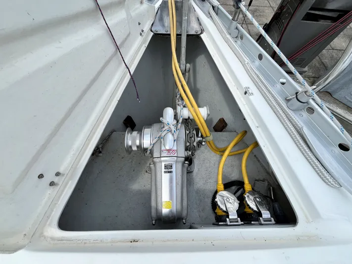 Lali Yacht Photos Pics Anchor locker of 1994 Beneteau Oceanis 510 CU sailboat with winch and yellow cables.