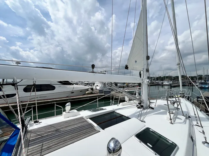 Lali Yacht Photos Pics Sailing yacht Beneteau Oceanis 510 CU, 1994 model, docked at marina under cloudy sky.