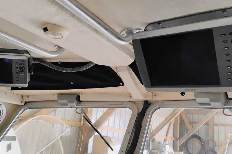  Yacht Photos Pics Interior of a 2009 McKee Craft 28 boat with Garmin navigation equipment.