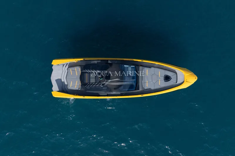 Fast Toy Yacht Photos Pics Aerial view of 2023 Tecnomar for Lamborghini 63 yacht on blue ocean water.