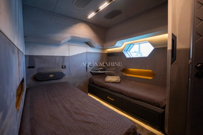 Fast Toy Yacht Photos Pics Luxurious 2023 Tecnomar for Lamborghini 63 yacht cabin with modern design and ambient lighting.