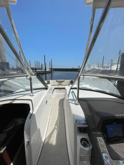 Black Pearl Yacht Photos Pics 2018 Chaparral 337 SSX boat interior with clear view of the dock and water.