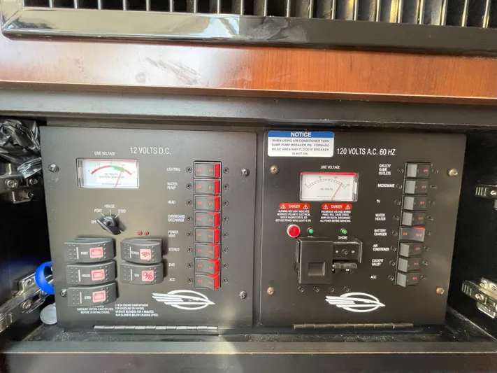 Black Pearl Yacht Photos Pics Control panel of a 2018 Chaparral 337 SSX boat showing 12V DC and 120V AC systems.