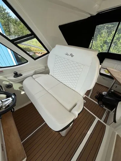  Yacht Photos Pics 2019 Sea Ray 350 Sundancer Coupe interior with white seating and wood flooring.
