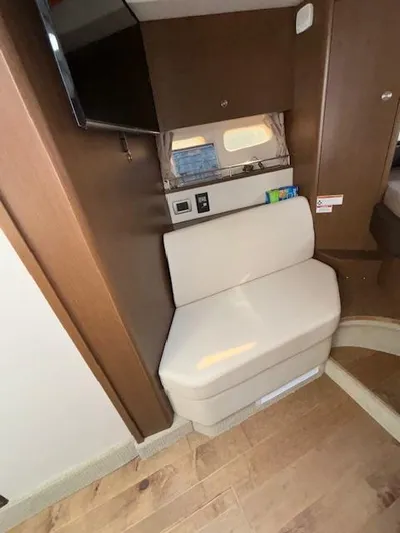  Yacht Photos Pics Interior of 2019 Sea Ray 350 Sundancer Coupe with beige seating and wood accents.