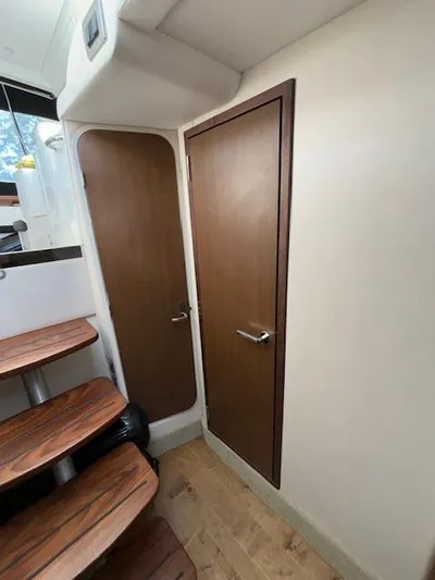  Yacht Photos Pics Interior of 2019 Sea Ray 350 Sundancer Coupe with wooden doors and stairs.