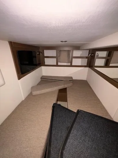  Yacht Photos Pics Interior cabin of 2019 Sea Ray 350 Sundancer Coupe with beige and wood accents.