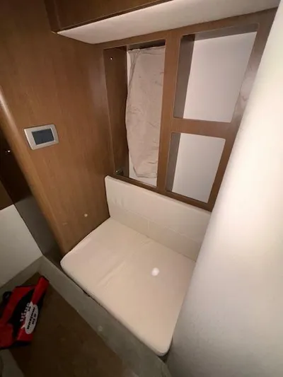  Yacht Photos Pics Interior cabin of 2019 Sea Ray 350 Sundancer Coupe with seating and wood paneling.