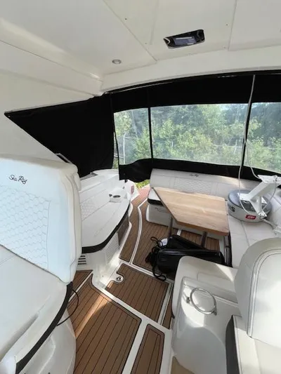 Yacht Photos Pics 2019 Sea Ray 350 Sundancer Coupe interior with seating and table.