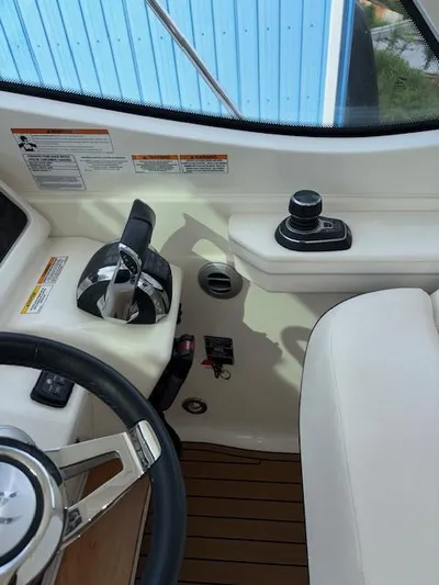  Yacht Photos Pics 2019 Sea Ray 350 Sundancer Coupe helm with controls and steering wheel.
