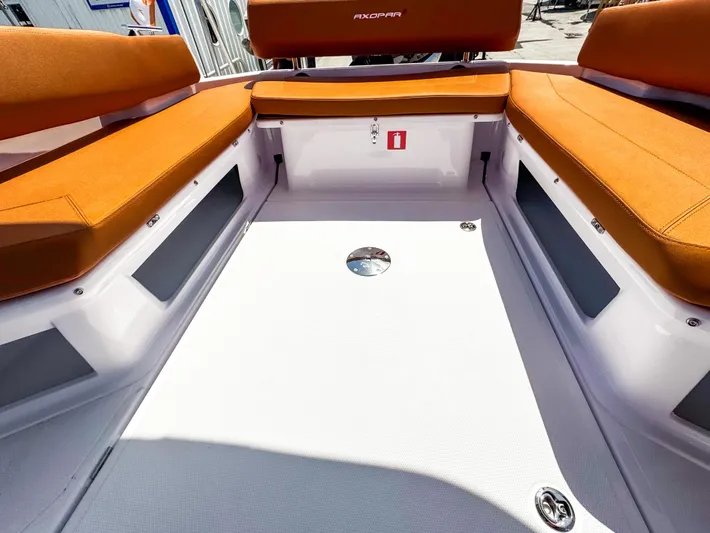  Yacht Photos Pics 2025 Axopar 25 Cross Top boat interior with orange seating and sleek design.
