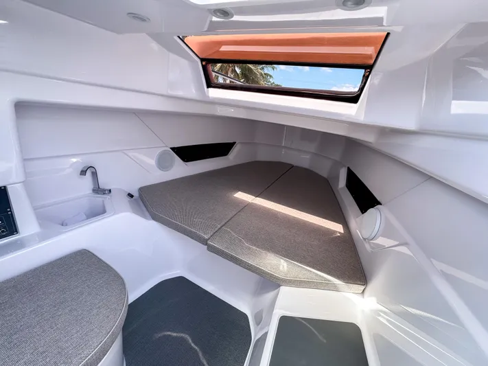  Yacht Photos Pics 2025 Axopar 25 Cross Top cabin interior with modern design and comfortable seating.