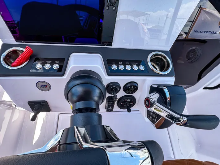  Yacht Photos Pics Control panel of 2025 Axopar 25 Cross Top boat with steering and throttle.