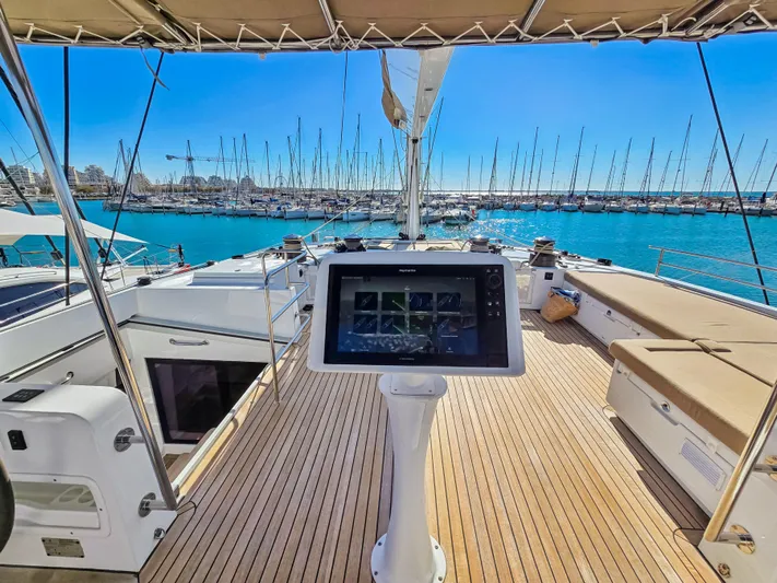 Firefly Yacht Photos Pics Luxurious Lagoon 620 NEO yacht deck with navigation screen, overlooking marina, 2012 model.