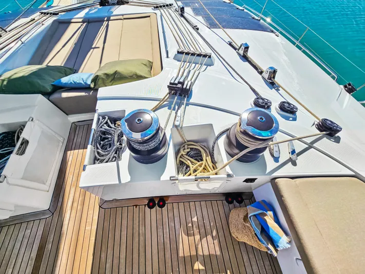 Firefly Yacht Photos Pics Deck of 2012 Lagoon 620 NEO yacht with winches and ropes, under sunny skies.