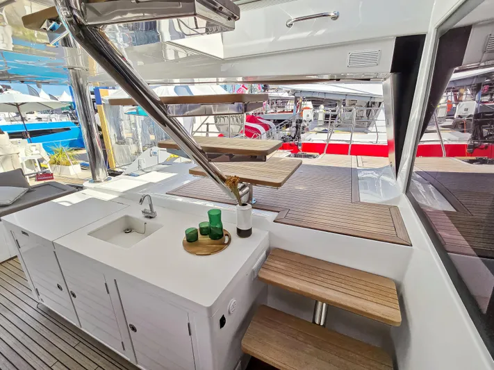 Firefly Yacht Photos Pics Luxurious Lagoon 620 NEO yacht interior with modern staircase and kitchenette, 2012 model.